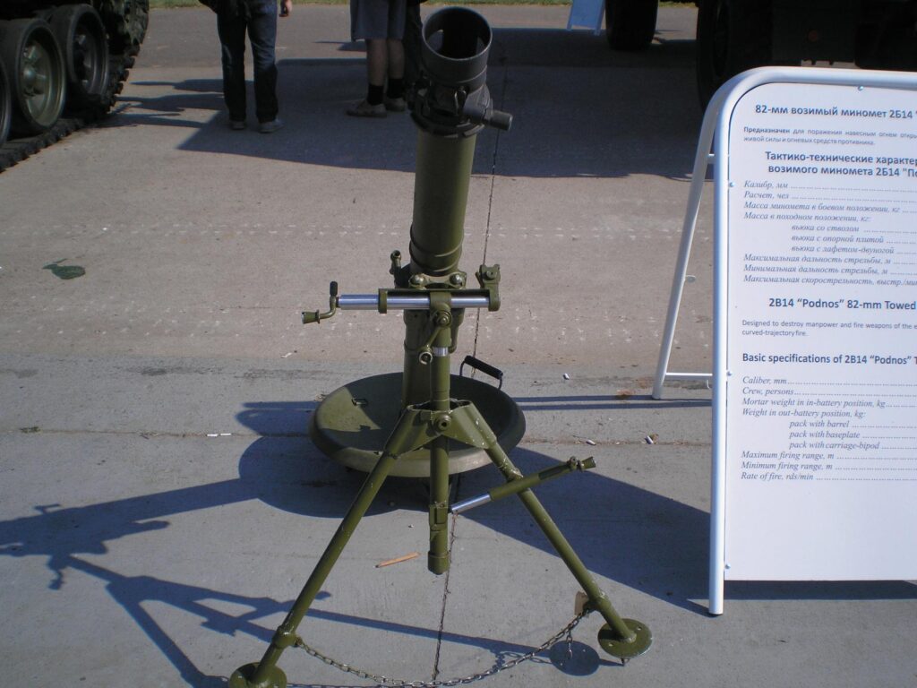 a green machine gun gun with a white background - File:2B14 Podnos at 'Engineering Technologies 2010